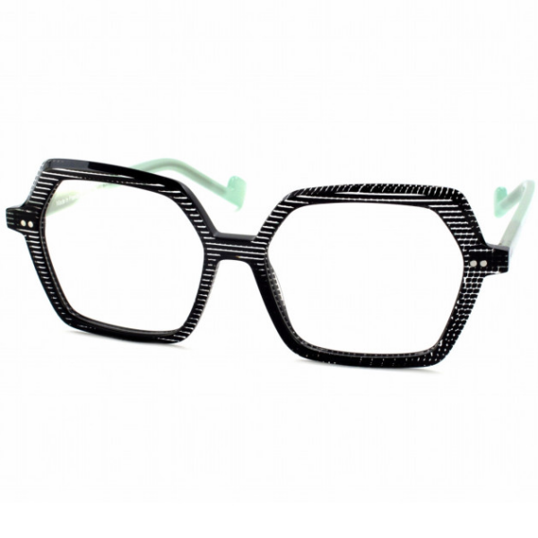 lunettes de la marque française XIT. Elles sont noires avec des branches vert clair